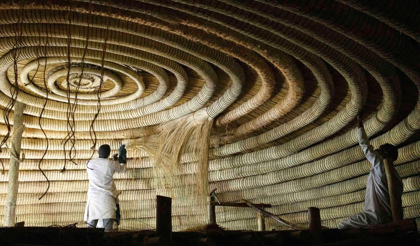 Artisans restoring the ceiling rings at the Kasubi Royal Tombs, Kampala · Photo: AFP